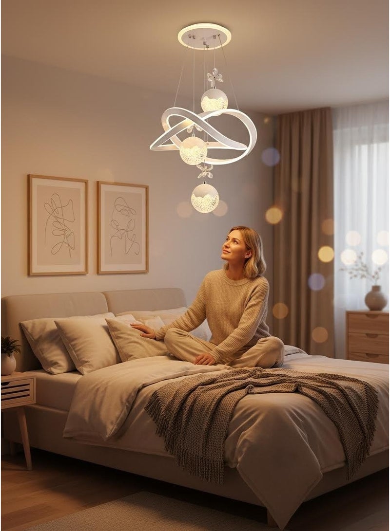 An LED chandelier decorated with crystals, with three adjustable lighting colors, controlled by remote control/switch, adjustable in height, suitable for above the dining table, bedroom, study, and living room. - Image 4